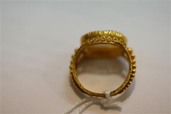 A 19th century two colour gold and oval cameo set ring, size F.